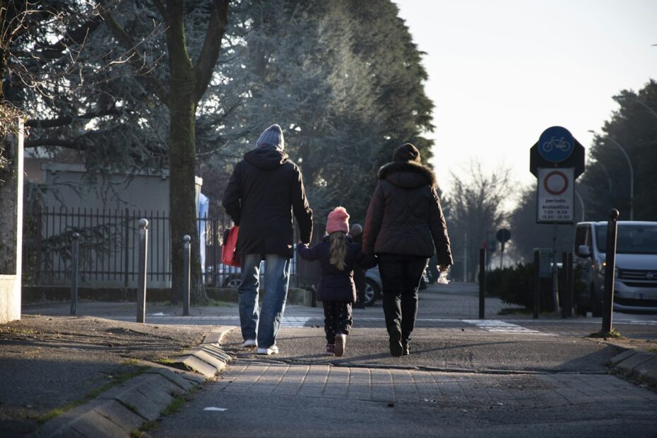 Parents walking with a child between them, representing emergency custody matters in Roanoke VA